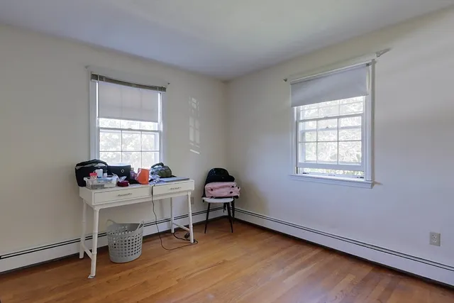 a workspace with furniture and a window