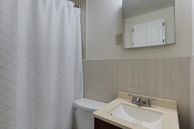 a bathroom with a sink and mirror