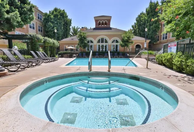 a view of a swimming pool with a patio