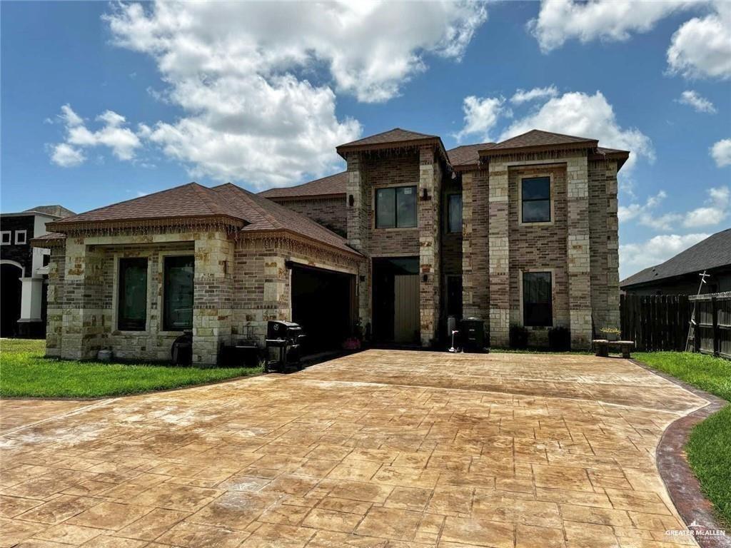 2117 Roman Street Mission, TX 78573 - Photo 16 of 17 a front view of a house with a yard