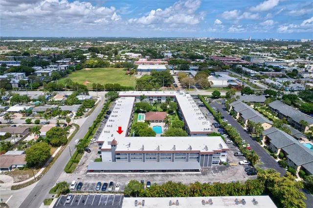 an aerial view of a house with a garden