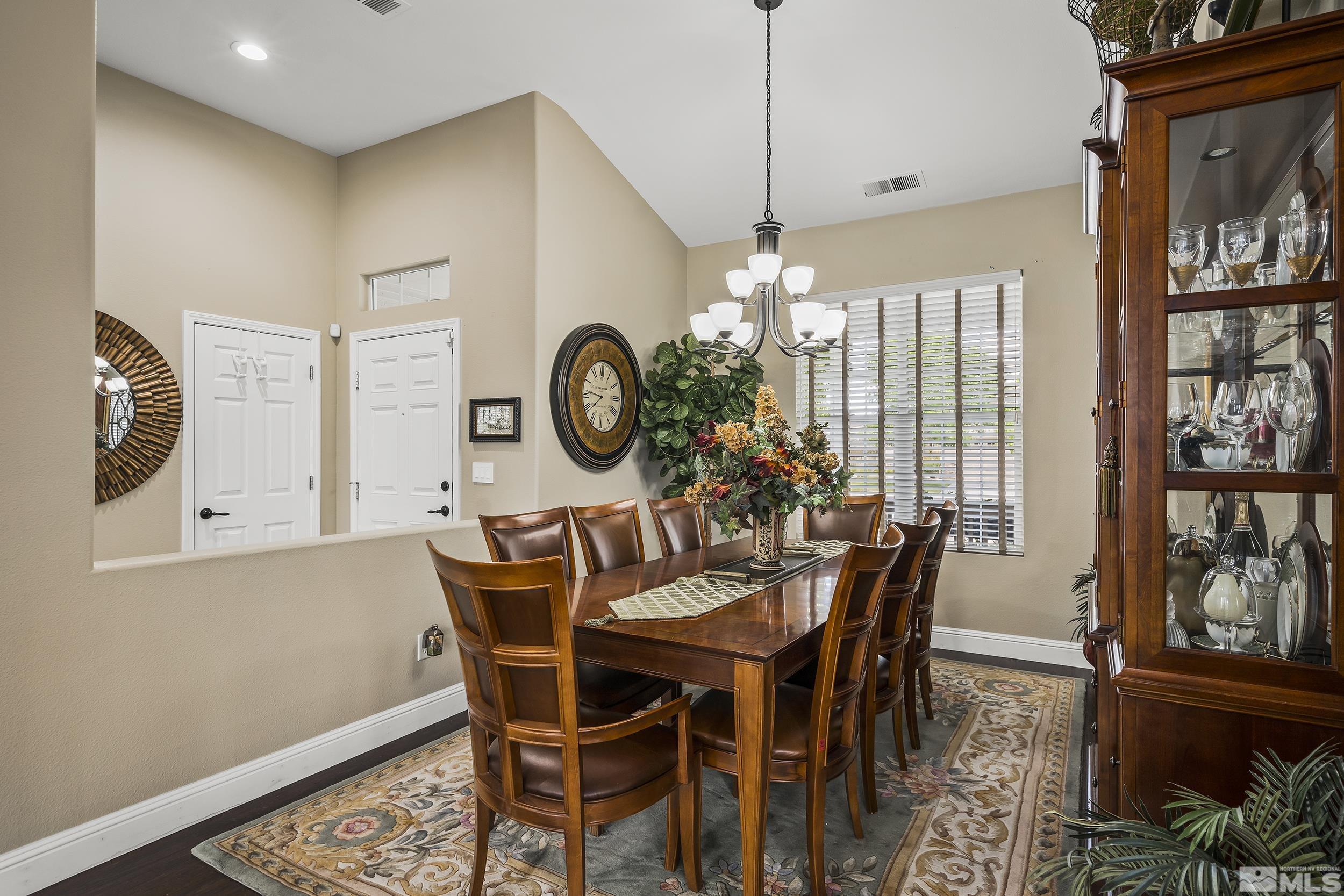 1484 Gaucho Lane Reno, NV 89521 - Photo 18 of 37 a view of a dining room with furniture window and wooden floor