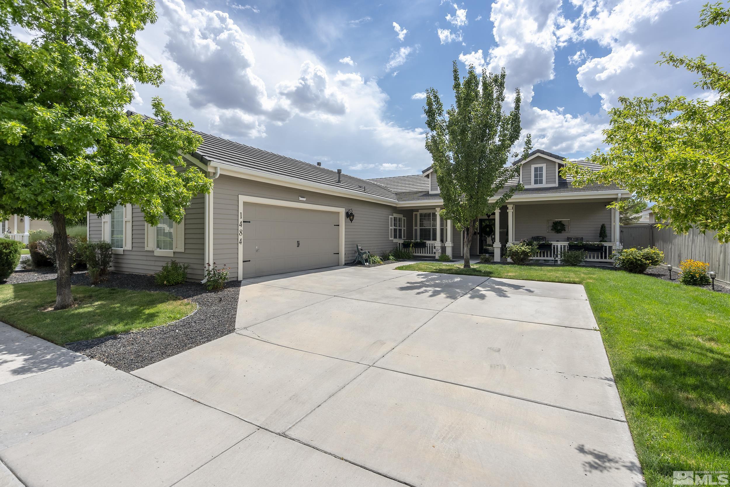 1484 Gaucho Lane Reno, NV 89521 - Photo 34 of 37 a front view of house with yard and green space