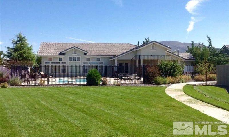 1484 Gaucho Lane Reno, NV 89521 - Photo 35 of 37 a front view of a house with a garden and trees