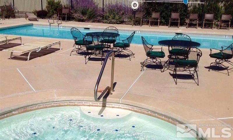 1484 Gaucho Lane Reno, NV 89521 - Photo 36 of 37 a view of a swimming pool with a patio