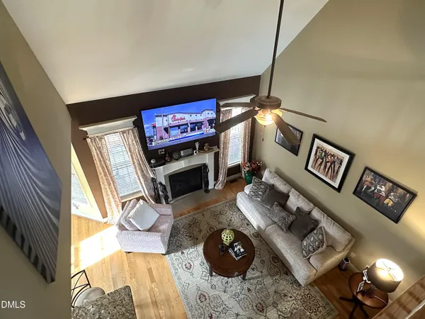 a view of a workspace with furniture and a fireplace