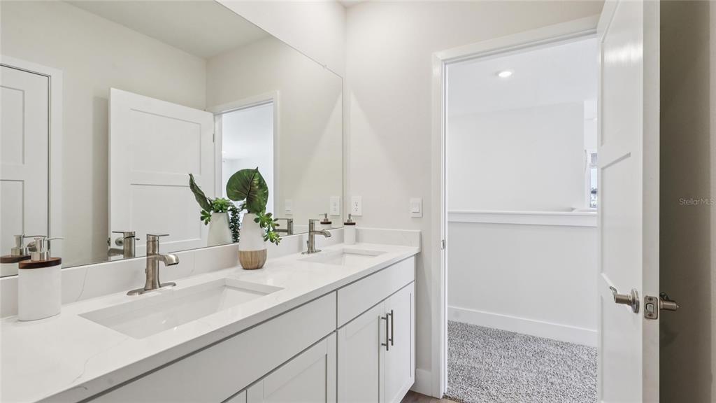 4216 Southwest 52nd Lane Road Ocala, FL 34474 - Photo 33 of 48 a bathroom with a sink and a mirror