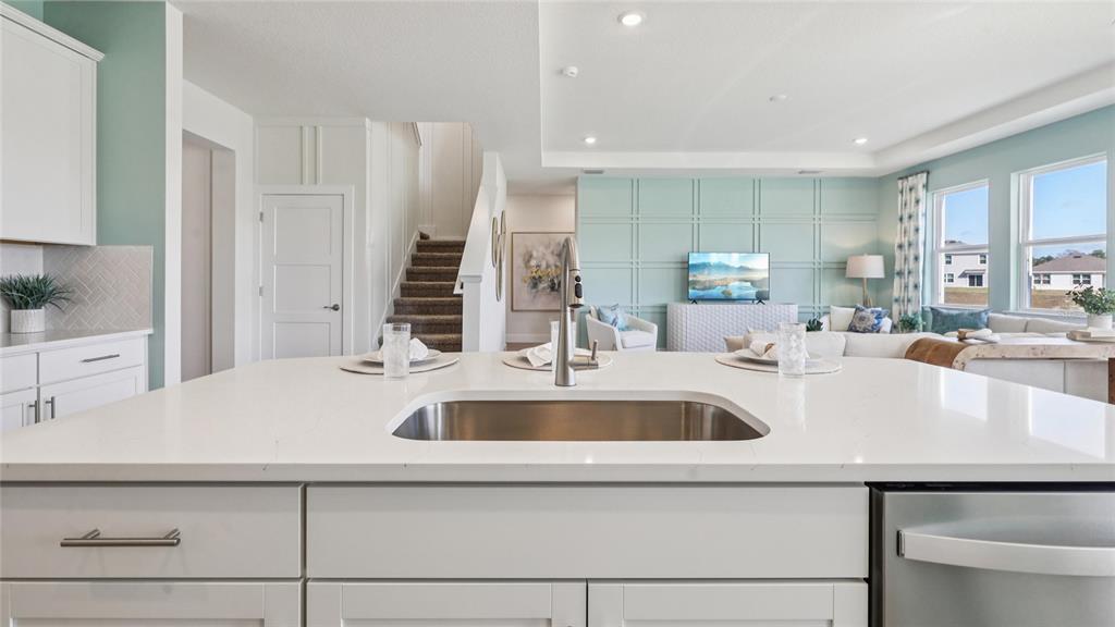4216 Southwest 52nd Lane Road Ocala, FL 34474 - Photo 6 of 48 a view with kitchen island a sink and a refrigerator