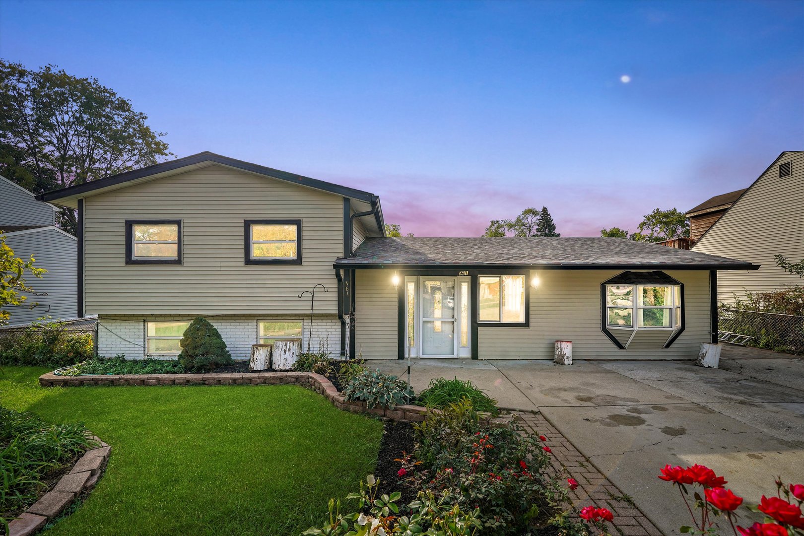 a front view of a house with a yard