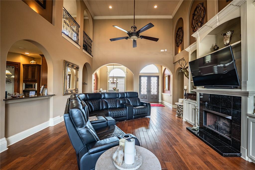 6739 Eagle Ridge Boulevard Lakeland, FL 33813 - Photo 16 of 54 a living room with furniture fireplace and wooden floor