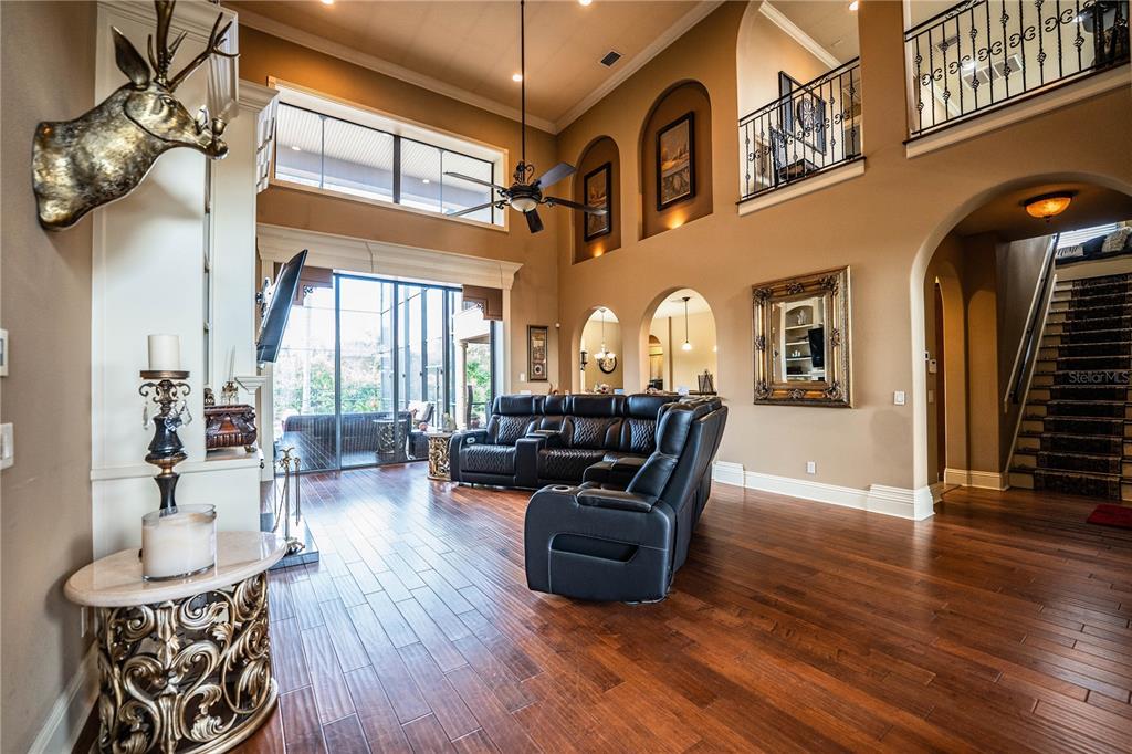 6739 Eagle Ridge Boulevard Lakeland, FL 33813 - Photo 17 of 54 a living room with furniture fireplace and wooden floor