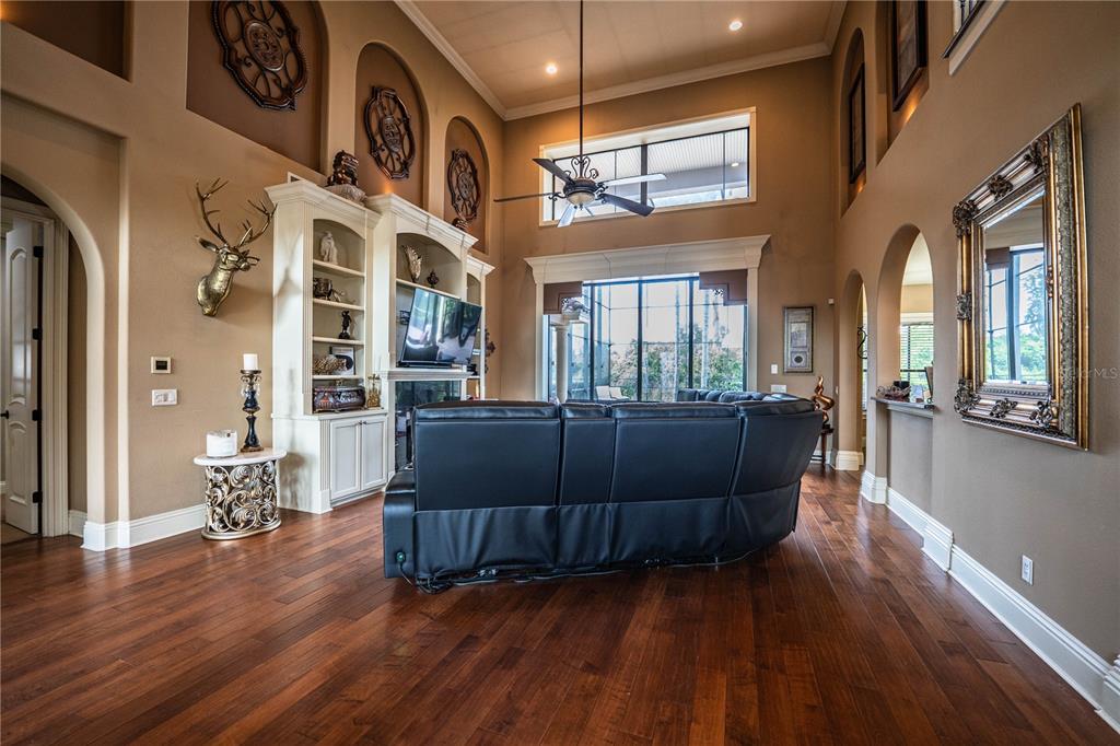 6739 Eagle Ridge Boulevard Lakeland, FL 33813 - Photo 18 of 54 a living room with furniture and wooden floor