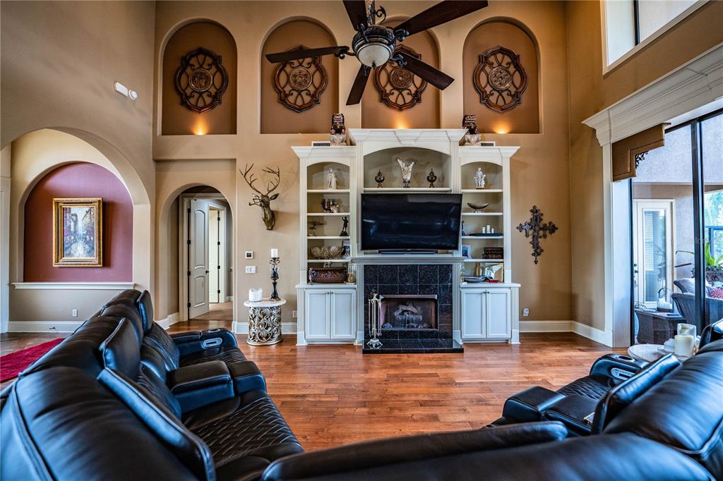 6739 Eagle Ridge Boulevard Lakeland, FL 33813 - Photo 19 of 54 a living room with fireplace furniture and a fireplace