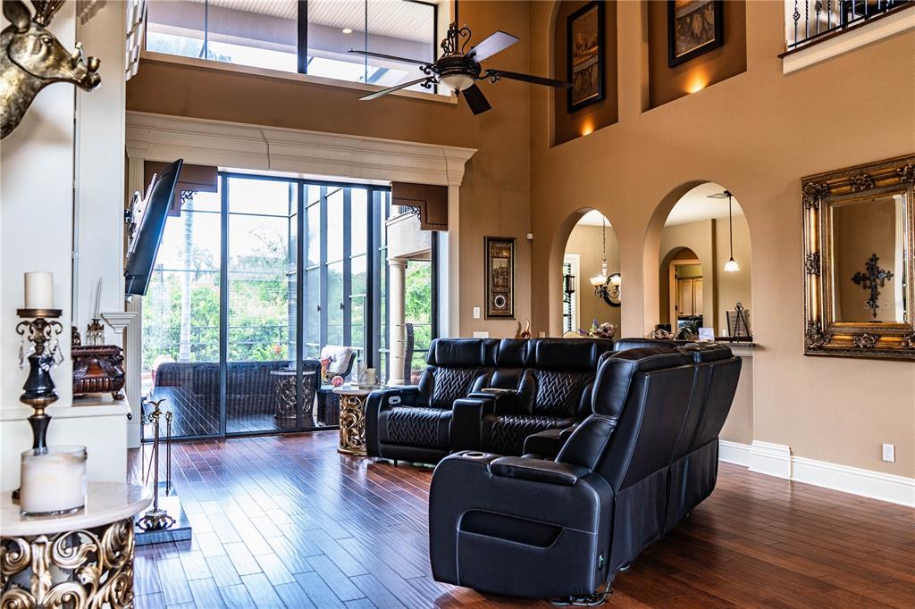 6739 Eagle Ridge Boulevard Lakeland, FL 33813 - Photo 2 of 54 a living room with furniture and wooden floors