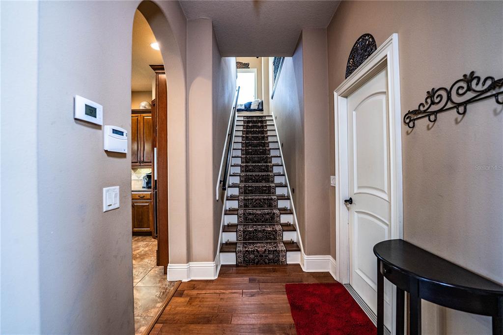 6739 Eagle Ridge Boulevard Lakeland, FL 33813 - Photo 21 of 54 a view of a hallway with windows and stairs