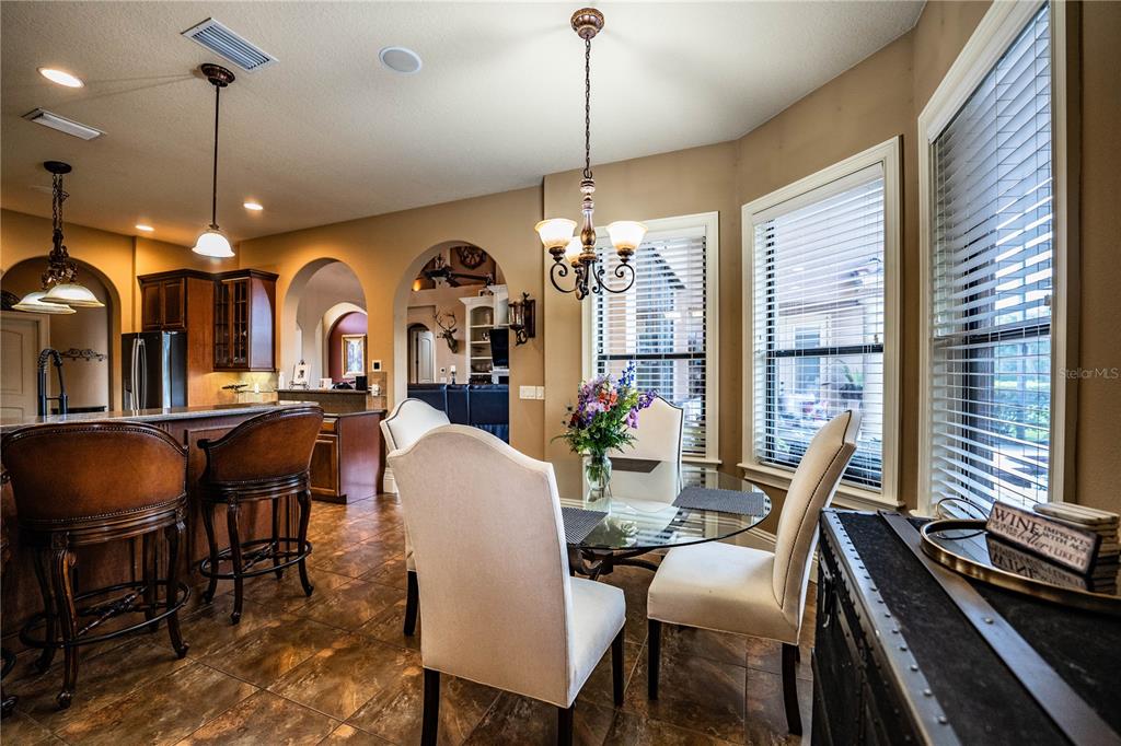 6739 Eagle Ridge Boulevard Lakeland, FL 33813 - Photo 25 of 54 a view of a dining room with furniture window and wooden floor