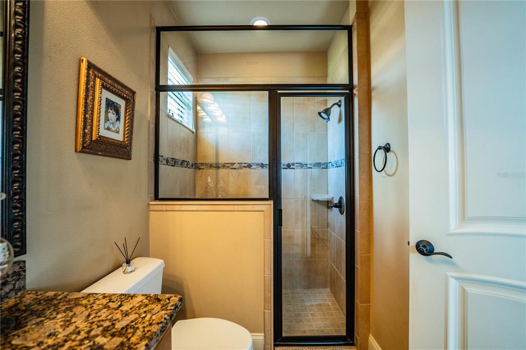 6739 Eagle Ridge Boulevard Lakeland, FL 33813 - Photo 28 of 54 a bathroom with a toilet and a shower