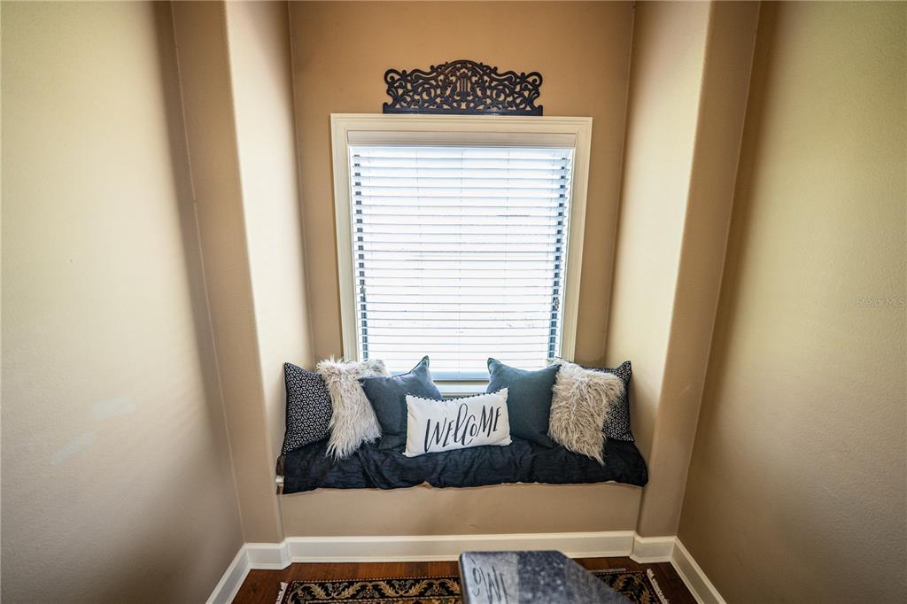 6739 Eagle Ridge Boulevard Lakeland, FL 33813 - Photo 30 of 54 a view of wooden floor and chair in a room