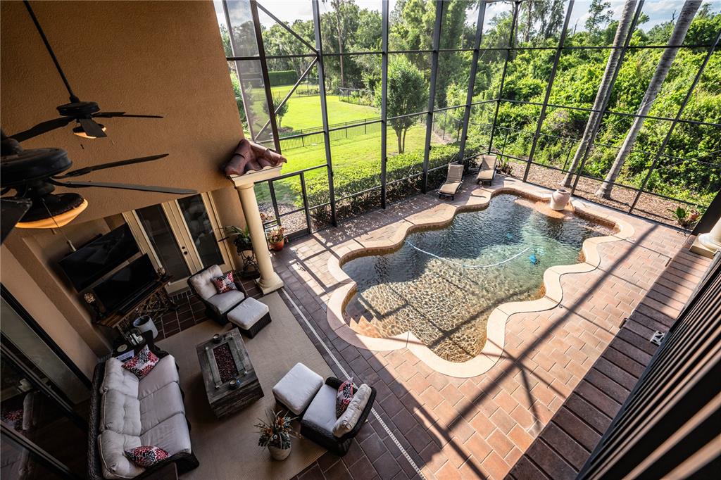 6739 Eagle Ridge Boulevard Lakeland, FL 33813 - Photo 39 of 54 a view of backyard of a house with seating space