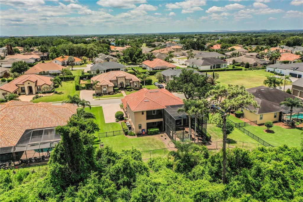 6739 Eagle Ridge Boulevard Lakeland, FL 33813 - Photo 44 of 54 an aerial view of multiple houses with yard