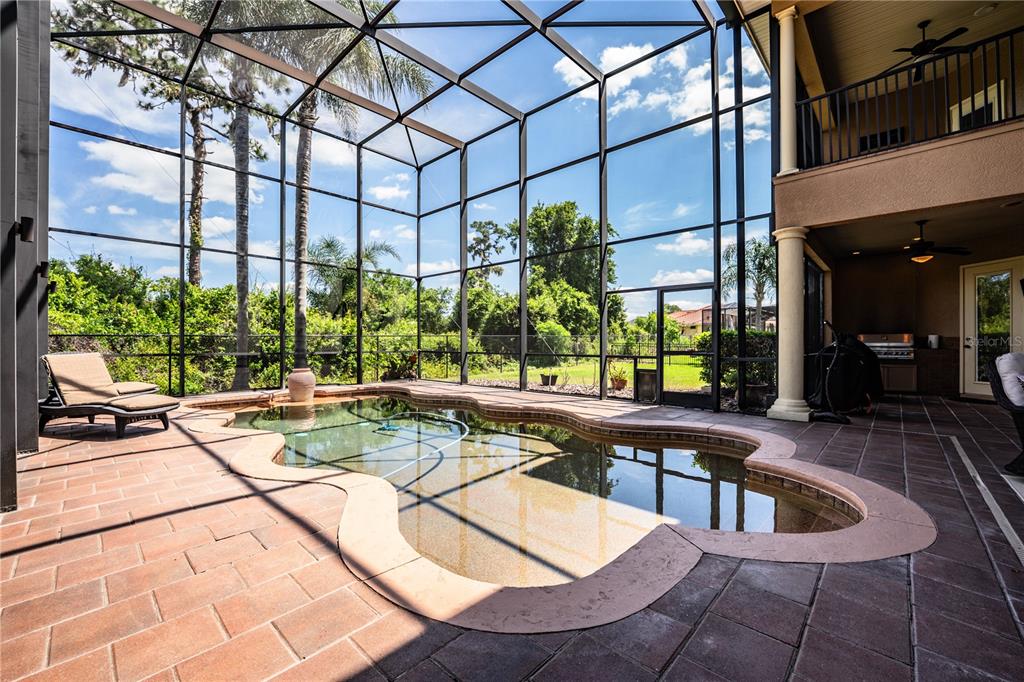 6739 Eagle Ridge Boulevard Lakeland, FL 33813 - Photo 49 of 54 a view of a swimming pool with chairs