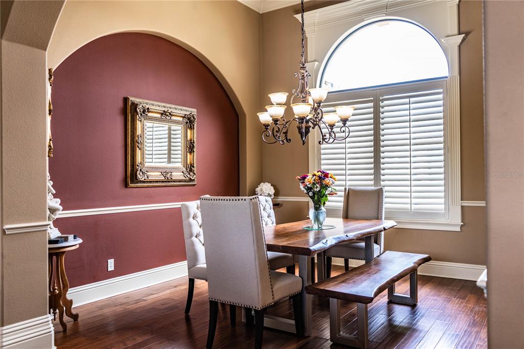 6739 Eagle Ridge Boulevard Lakeland, FL 33813 - Photo 5 of 54 a view of a dining room with furniture and chandelier
