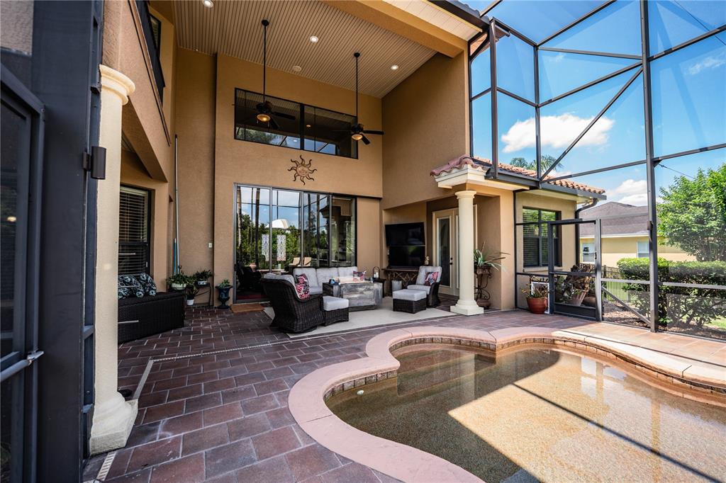6739 Eagle Ridge Boulevard Lakeland, FL 33813 - Photo 52 of 54 a view of a patio with chairs and tables
