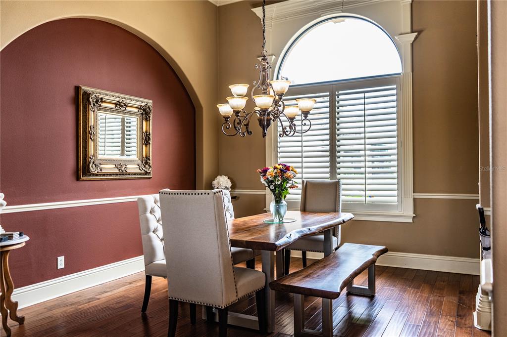 6739 Eagle Ridge Boulevard Lakeland, FL 33813 - Photo 6 of 54 a view of a dining room with furniture and wooden floor