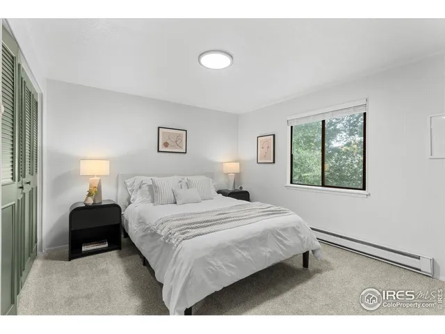 a bedroom with a bed and a cabinets