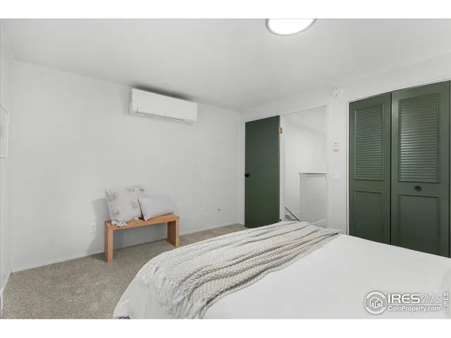 a bedroom with a bed and a view of bathroom