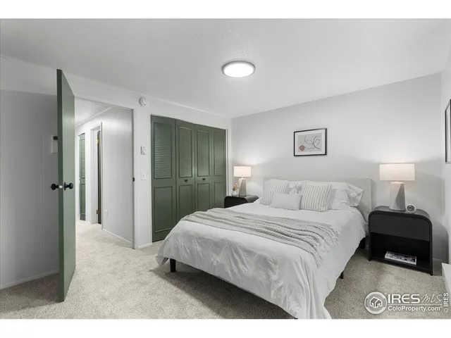 a bathroom with a granite countertop sink toilet a large mirror and shower