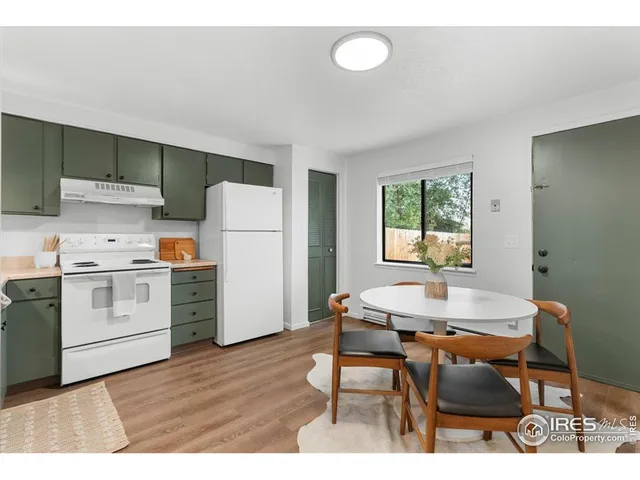 a open dining room with a table and chairs