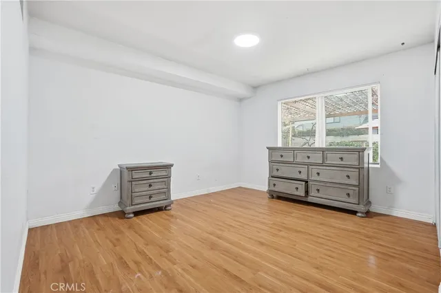 an empty room with a dresser