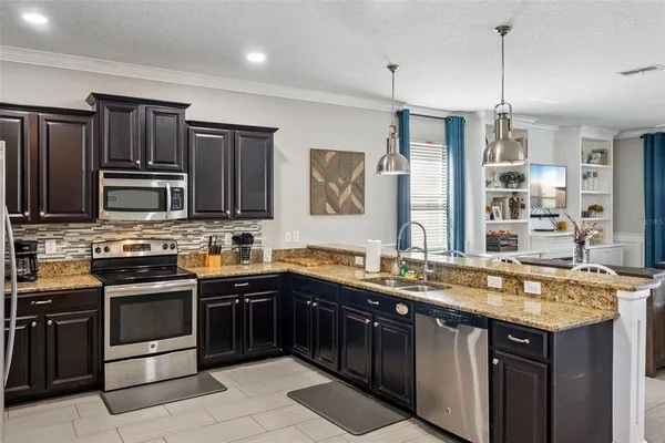 $724,900 | 1414 Moon Valley Drive, Davenport, FL 33896