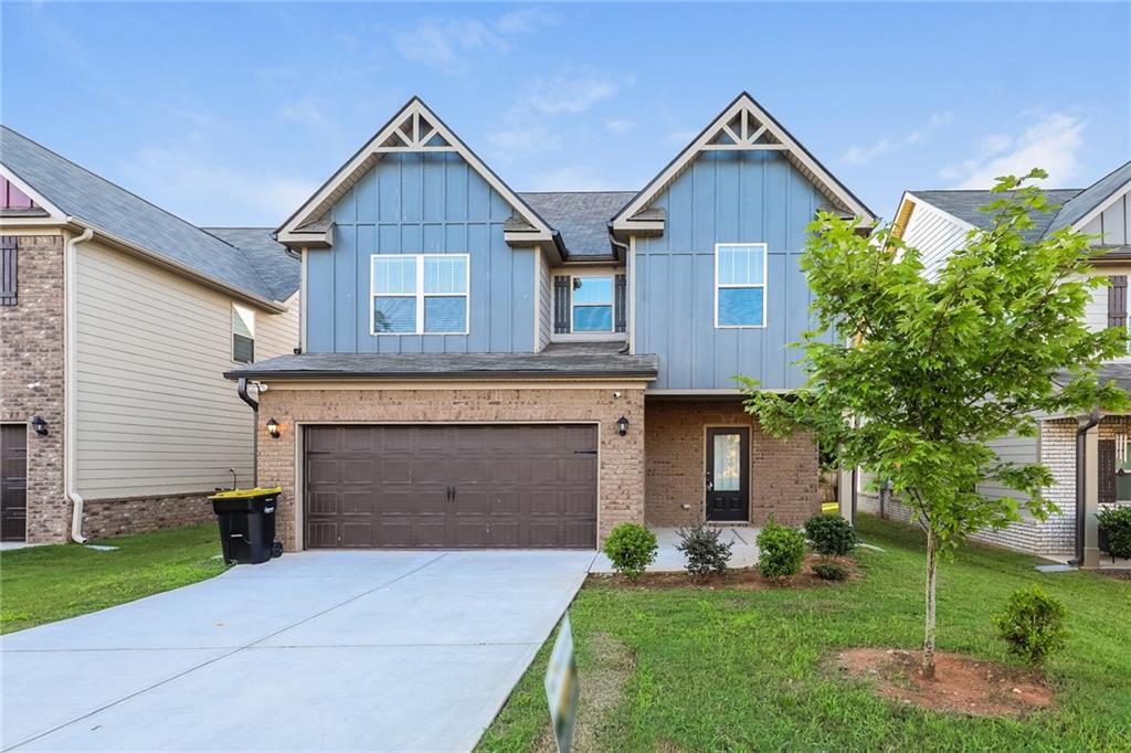 2287 Church Street Hampton, GA 30228 - Photo 1 of 11 a front view of a house with a garden and plants
