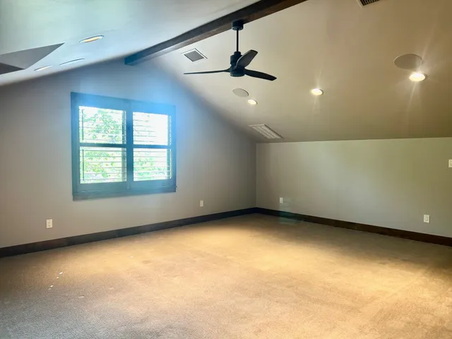 a bathroom with a sink a toilet a mirror and bathtub