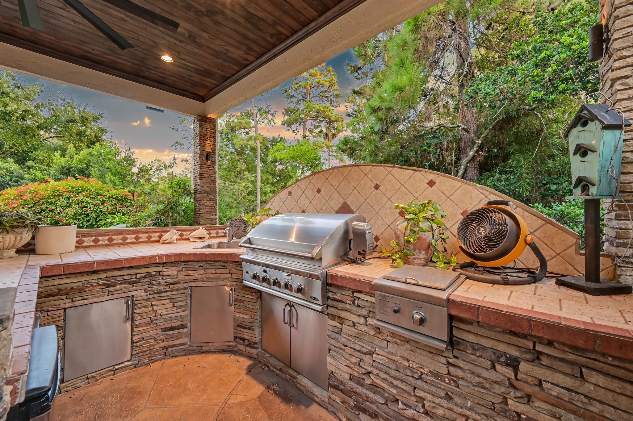 22 Watertree Court Spring, TX 77380 - Photo 17 of 45 Fully equipped outdoor kitchen featuring a built-in stainless steel grill, generous counter space, and custom stonework—perfect for outdoor entertaining.