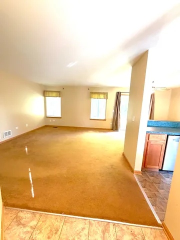 a view of an empty room and window