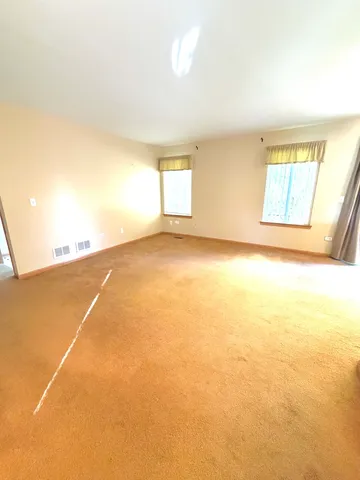 a view of an empty room with window