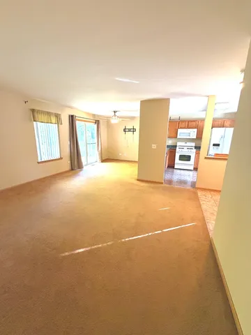 a view of a livingroom with a refrigerator