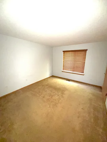 an empty room with a empty space and windows