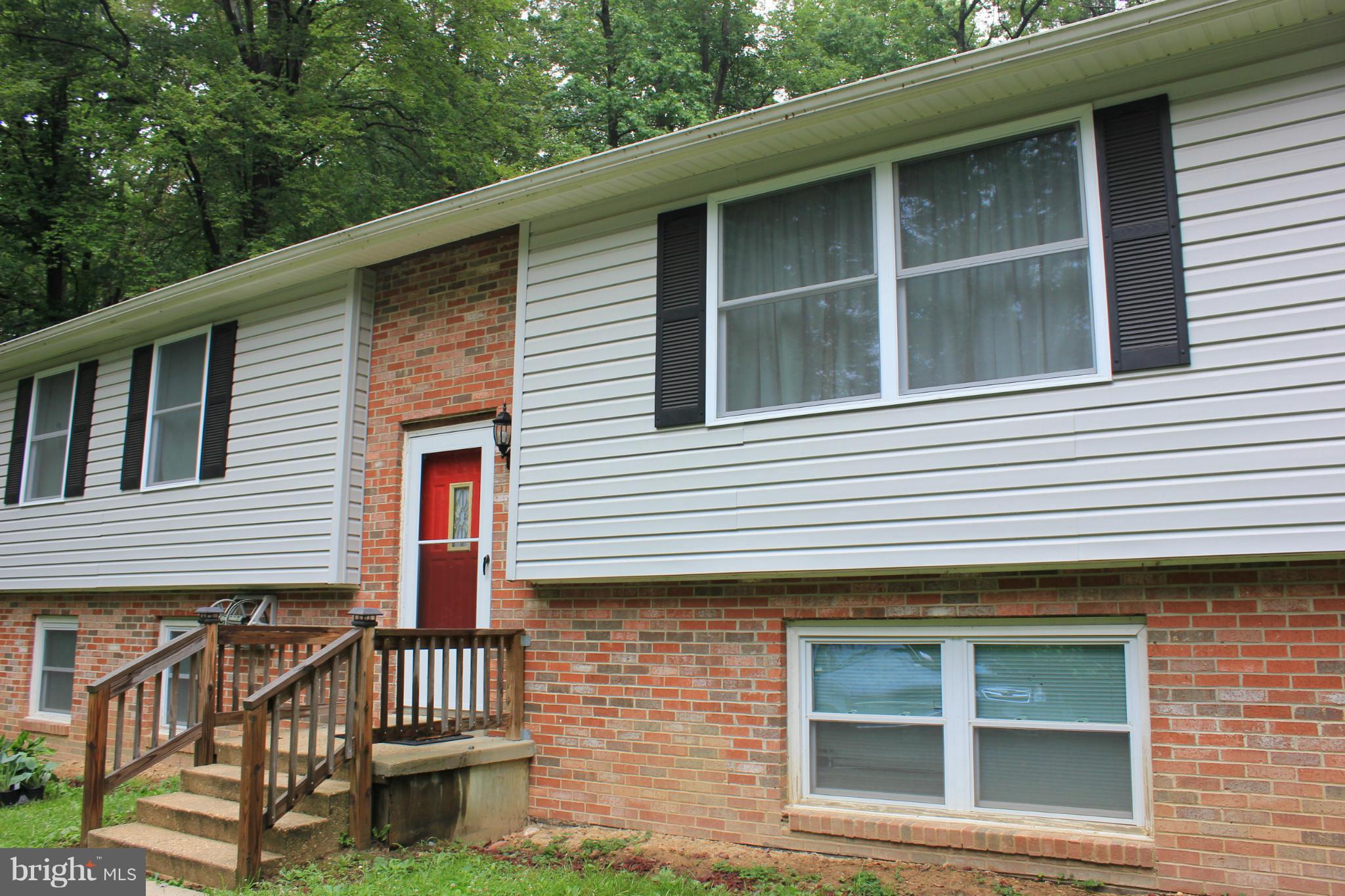 11602 Jester Way Dunkirk, MD 20754 - Photo 1 of 23 a front view of a house with a yard