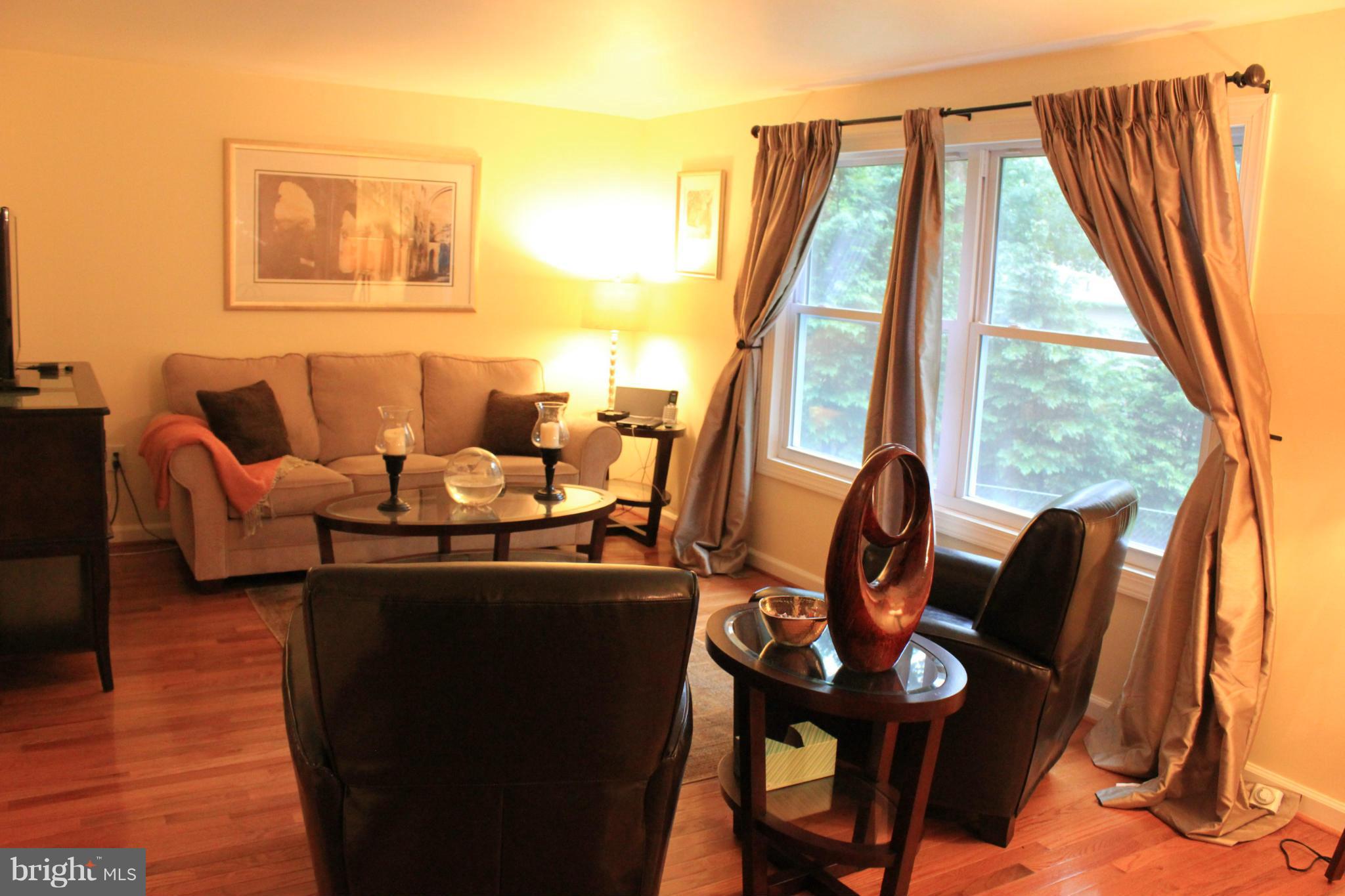 11602 Jester Way Dunkirk, MD 20754 - Photo 2 of 23 a living room with furniture and a floor to ceiling window