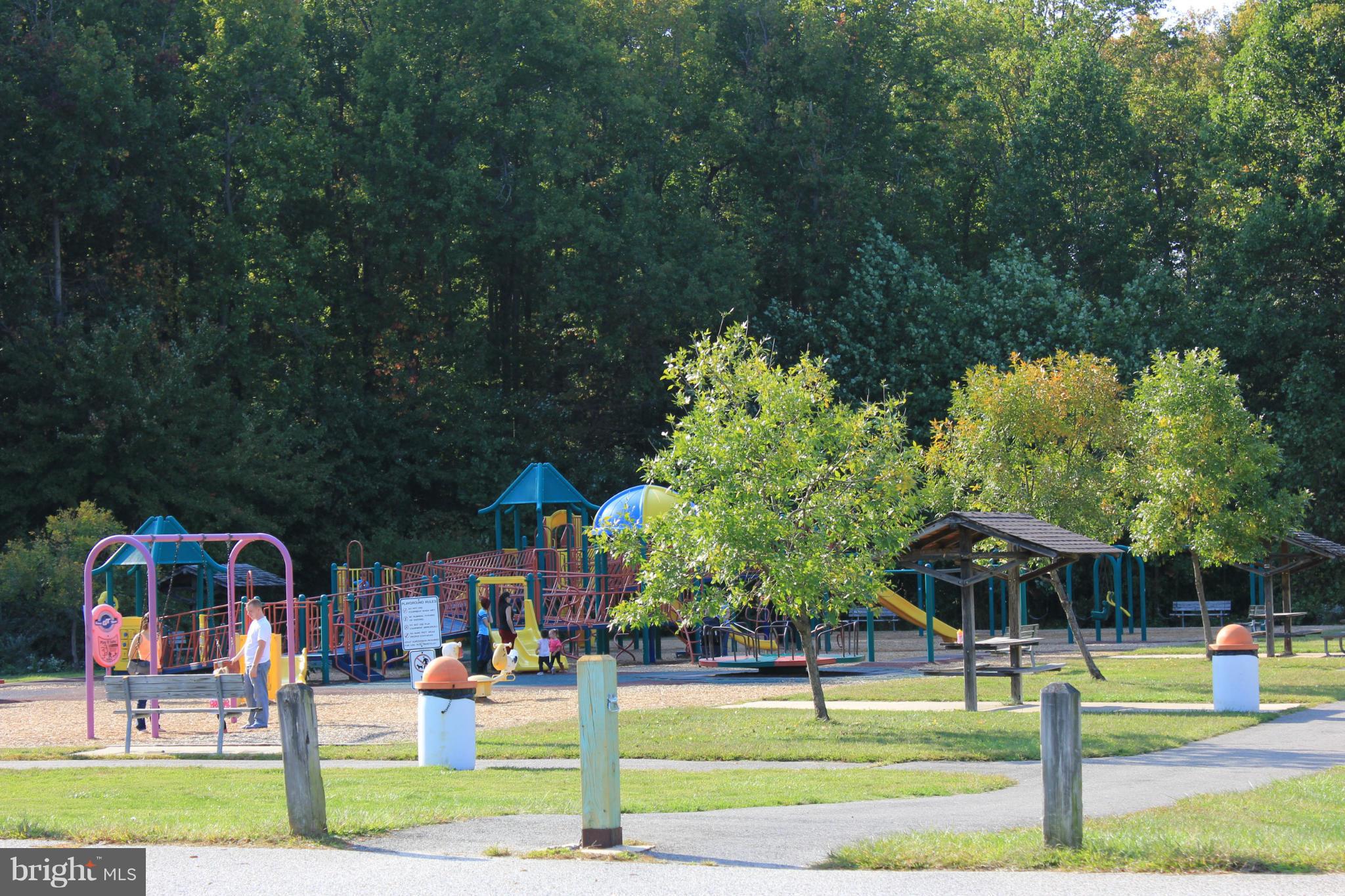 11602 Jester Way Dunkirk, MD 20754 - Photo 22 of 23 a view of a park with swings and slides