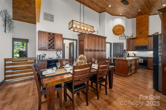a view of a workspace with furniture and a kitchen