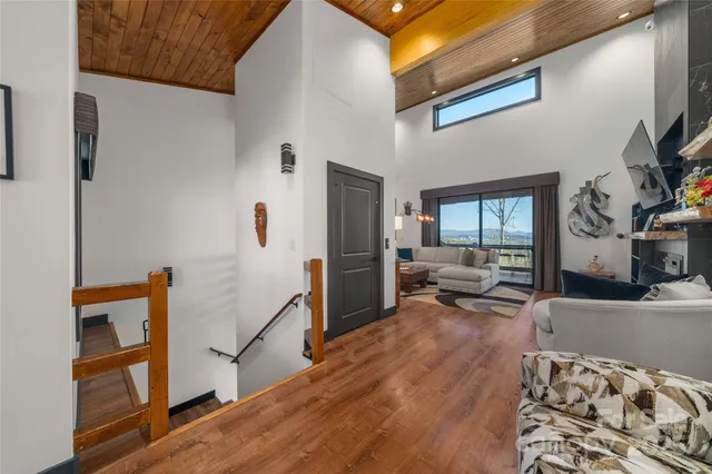 a bedroom with furniture and wooden floor