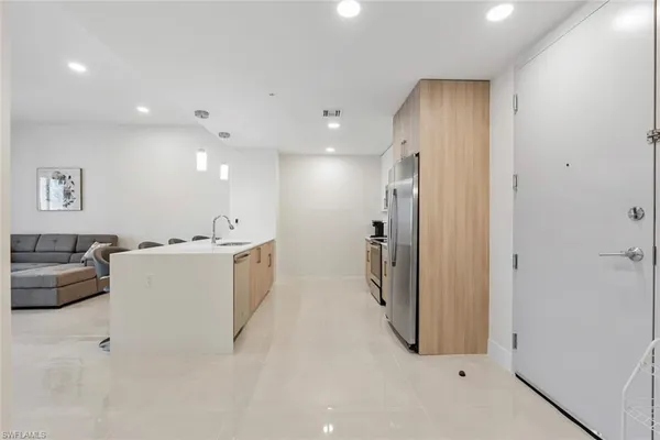 a view of a room with kitchen and living room