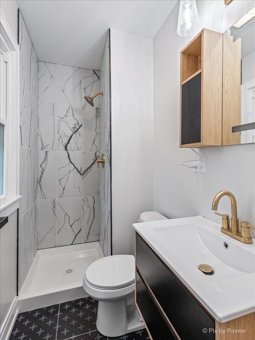 542 East Briarcliff Road Bolingbrook, IL 60440 - Photo 15 of 26 a bathroom with a sink toilet and shower