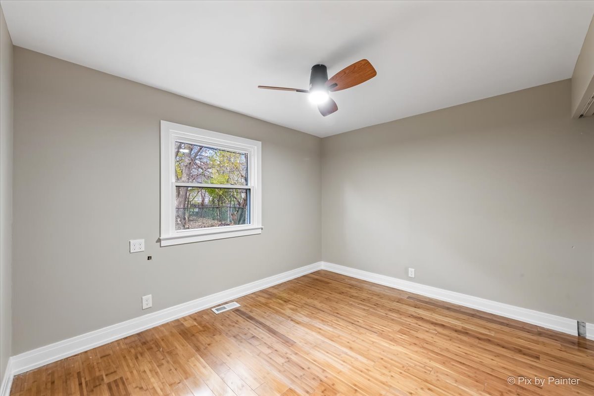 542 East Briarcliff Road Bolingbrook, IL 60440 - Photo 16 of 26 a view of empty room with wooden floor