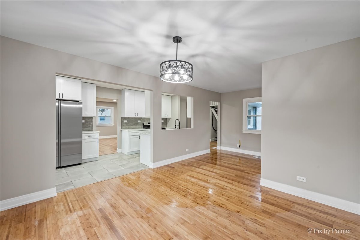 542 East Briarcliff Road Bolingbrook, IL 60440 - Photo 8 of 26 a view of a kitchen with refrigerator and window